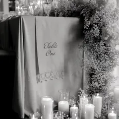 My basics are clear, no basic please. This black and white shot of a tablescape highlights the elegance of simplicity: clean lines, beautiful baby's breath, and the soft glow of candlelight.