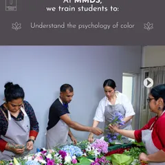 Here, students are learning the psychology of color in a hands-on session. They are working together to understand how different color combinations evoke different emotions, a fundamental skill for any floral designer.
