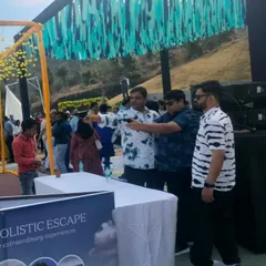 Guests taking aim at the balloon shooting stall during a Haldi function. My carnival games are a perfect icebreaker and add a unique element to wedding festivities.