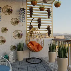 This bohemian-inspired balcony uses a mix of textures and natural materials. An orange-cushioned egg swing provides a comfortable focal point, while wall decor and snake plants in minimalist pots complete the chic, relaxed vibe.