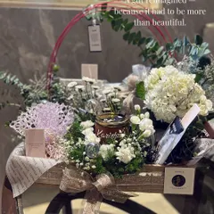 Some gifts must be more than beautiful; they must tell a story. This hamper for a brand launch was completely reimagined to honor the founder's journey, using hydrangeas, custom quotes, and layered textures to reflect the elegance of her new brand.