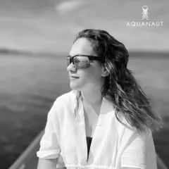 A portrait of one of our divers, radiating joy and confidence. The ocean has a way of bringing out the best in us.