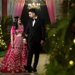 A candid walk during their engagement party. I look for these natural interactions, where the couple is simply enjoying the moment. This photo captures their connection amidst the beautiful, softly lit decor of their celebration.