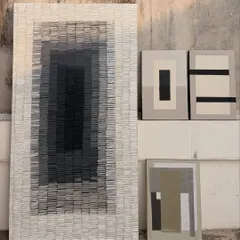 The full set of artworks for the residential space in Surat. It includes the large textured gradient piece and three smaller geometric abstracts, all designed to work together in a single room.