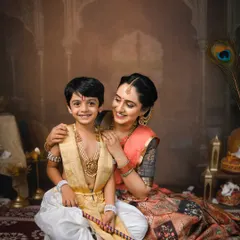 A mother's love for her son, captured during our special Janmashtami mini-sessions. The intricate details of the costumes and the warm lighting bring this cultural story to life.
