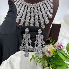 The same cascading necklace design, but with soft pink stones for a touch of color.