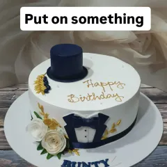 A dapper cake for a true gentleman. This design features a fondant tuxedo, top hat, and bow tie, making it a classy choice for a birthday celebration.