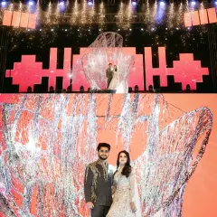 A closer look at the spectacular sangeet entry. The couple stands inside a custom-designed shimmering structure, framed by a massive LED screen and dazzling pyrotechnics, making for an epic photo opportunity.