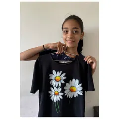 This lovely daisy t-shirt was painted by an 8th-grade student in one of my workshops. It shows how anyone can learn to create beautiful, wearable art with a little guidance and creativity.