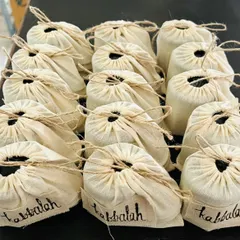 A large order of my handmade products ready for a corporate event. Each item is individually packed in an eco-friendly cloth pouch, showing that even bulk orders have a personal, handcrafted touch.