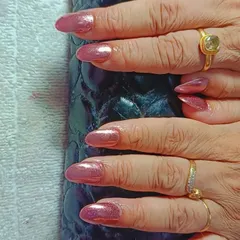 For a sleek and metallic look, I offer chrome finishes. These almond-shaped nails have a beautiful rose gold chrome effect that is both trendy and sophisticated.