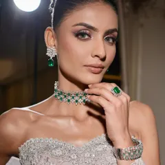 This is modern elegance with an edge. I created this sculpted glam look with shimmering silver and lilac eyeshadow, flawless skin, and bold brows, perfectly complemented by a stunning emerald and diamond choker for a high-fashion, reception-ready finish.