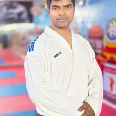 A formal portrait in my karate gi. I lead by example, embodying the discipline and respect that I teach to all my students.