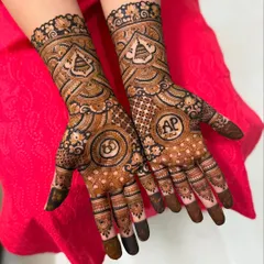 This engagement design features the couple's initials 'A' and 'P' and wedding rings in circular frames. The surrounding patterns are intricate yet leave some skin showing for an elegant look.
