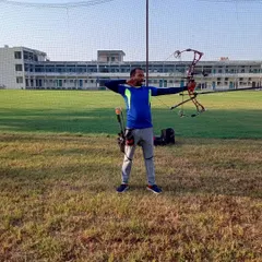 An archer takes aim with a compound bow during a practice session on our open field. I provide coaching that focuses on proper form, safety, and aiming techniques for both beginners and experienced archers.