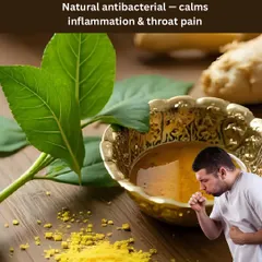 For a sore throat or cough, this natural antibacterial mix of honey, tulsi, and ginger juice is a go-to remedy. It calms inflammation and provides soothing relief.