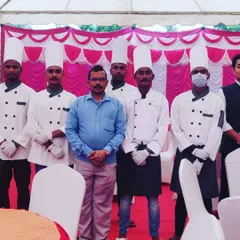 Posing with my hardworking team. Their dedication is key to the success of every event I cater.