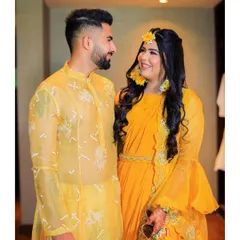 This portrait captures the happy couple during their Haldi ceremony. We focus on creating relaxed and natural couple portraits amidst the vibrant celebrations.