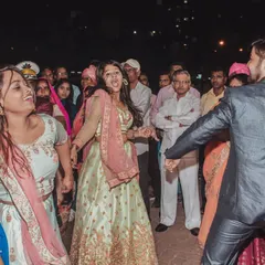 That moment when friends and family own the dance floor. These candid shots of wedding guests having a blast are essential parts of the story.