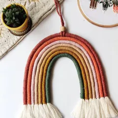I love the warm, earthy tones in this custom rainbow hanging. It's a more subtle take on the classic rainbow design and looks beautiful as a piece of wall decor.