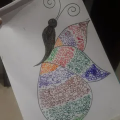 Another wonderful butterfly from our art session. Each child brings their own unique style to the project, choosing different color combinations and patterns to make their artwork special.