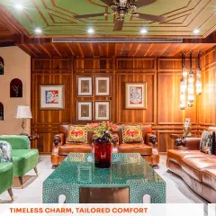 I believe a living room should have soul. For this space, I used warm wood paneling, a custom-designed green malachite table, and rich leather sofas to create a classic, inviting atmosphere that feels both grand and comfortable.