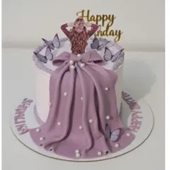 A beautiful lilac dress cake, one of my favorite designs to recreate. This preservative-free cake is decorated with a flowing fondant gown and delicate butterflies.