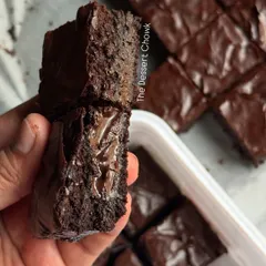 This is what pure indulgence looks like. A cross-section of my brownie showing the gooey, melted chocolate pocket inside. It's all about that rich, fudgy texture.