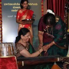 A guest honoring me on stage after a concert in Jaynagar. The love and respect from organizers and audiences mean the world to me.