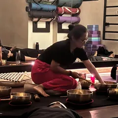 Preparing the instruments for a Naada Yoga session. Each bowl has a unique frequency that works on different energy centers in the body, helping to restore balance and harmony.