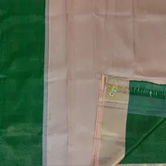 A flat-lay view of a classic pure Kanjivaram silk saree. This shows the beautiful contrast between the light peach body and the traditional green border, a timeless combination for any special occasion.