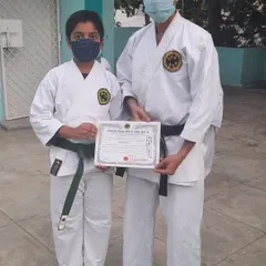 A young karateka, Atharv, receiving his kyu grading certificate. I congratulate him on this achievement and encourage his continued practice in traditional Okinawan karate.