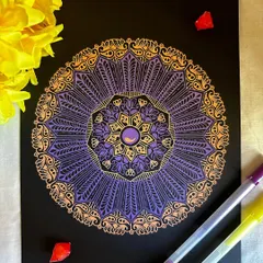 The combination of purple and gold on black paper feels so royal and elegant. This gelly roll mandala has a beautiful shimmer, with intricate patterns that catch the light and draw you in.