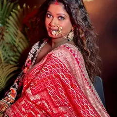 Perfect makeup for a perfect mood. This stunning look on a dusky skin model features a flawless base, smokey eyes, and a traditional nath, creating a powerful and regal vibe.