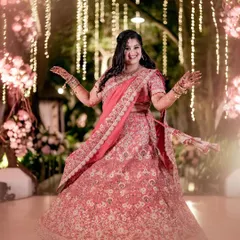 Our bride Bhumi, twirling with joy at her reception. The backdrop of twinkling fairy lights and lush floral arrangements was designed to make her feel like she was in a dream, and her radiant smile says it all.