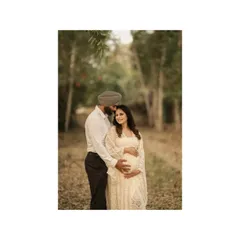 A close-up portrait of the couple in the woods, his hands gently holding her baby bump. These are the pages of pure love, a mother's words to her beloved baby, captured forever.
