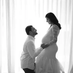 A romantic black and white silhouette. This high-contrast style creates a powerful and emotional image, focusing on the connection between the couple.