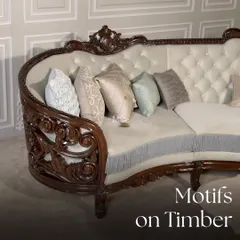 This curved sofa from our Motifs on Timber collection is a testament to artistry. The intricately carved dark wood frame is paired with tufted velvet upholstery and subtle fringe accents, fusing traditional craftsmanship with a modern, elegant form.
