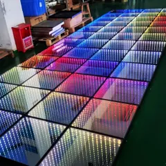 A full view of the 3D infinity mirror LED dance floor. The rainbow effect shows its versatility. I can program it to display any color or pattern to match your event's theme perfectly.