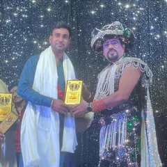 Being presented with an award by Magician Ajooba ji. His blessings and recognition fuel my journey forward.
