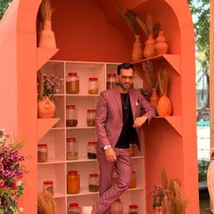Suit up, show up, and never settle. A shot of me in a stylish suit against a cool, rustic backdrop. Confidence and style are key elements of my on-stage persona.
