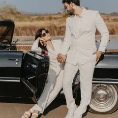 A chic and stylish shot with a vintage convertible in Goa. The couple's matching white power suits create a look that is both classic Hollywood and incredibly modern.