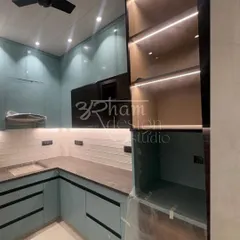 This modern kitchen showcases our love for functional beauty. We used a soothing green palette for the cabinetry, combining solid surfaces with fluted glass and integrated under-cabinet lighting to create a workspace that is both stylish and practical.