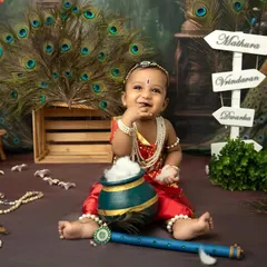 Celebrating Janmashtami with your little Krishna is a memory to treasure. This studio session features a detailed, traditional setup with peacock feathers and playful props to capture the divine spirit of the festival.