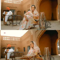 A scene depicting traditional Punjabi life, with the couple in classic attire in a rustic village courtyard. The 'charkha' (spinning wheel) adds an authentic touch.