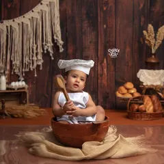 This little chef is busy baking up some cookies! Our rustic bakery theme is a sweet and creative way to capture your baby's playful personality.