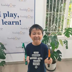 Look at that happy smile! This camper is thrilled to be holding a saw and hammer, ready for his next building project. My goal is to make learning engineering skills feel like an exciting adventure.