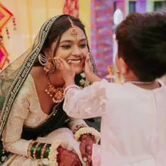 The haldi ceremony is full of pure, candid moments like this one. Capturing the genuine joy and affection between the bride and her family is what makes my job so special.