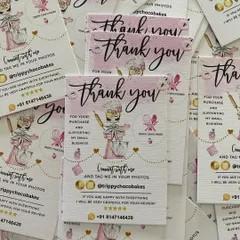 A stack of freshly printed thank you cards, ready to be included in customer orders to add a personal and professional touch.