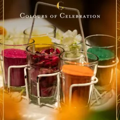 A colourful array of welcome shots, presented in a traditional cutting chai glass holder. Each glass holds a different vibrant flavour, offering a playful and festive start to the event.